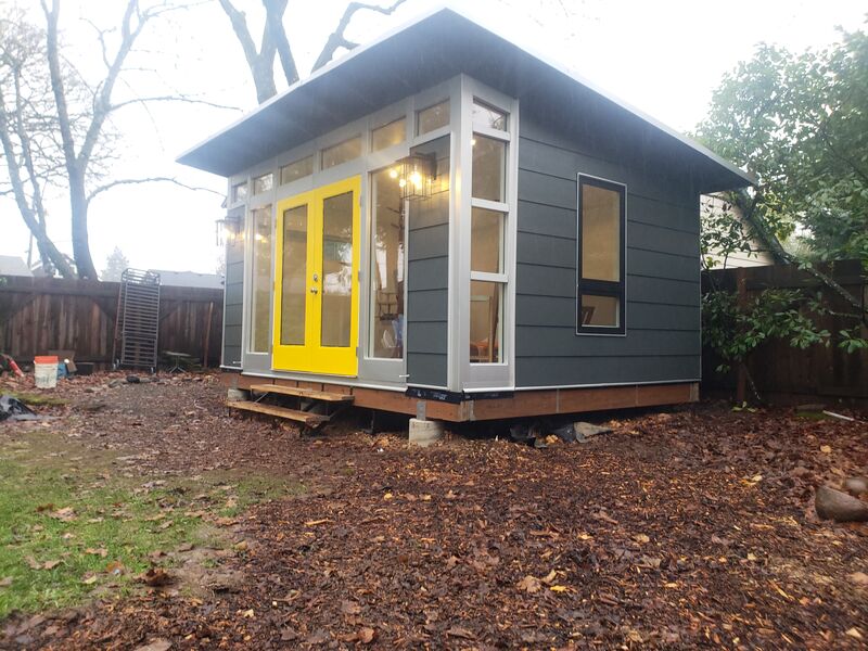 Completed gray studio shed, side view by ArchAngel Construction Services