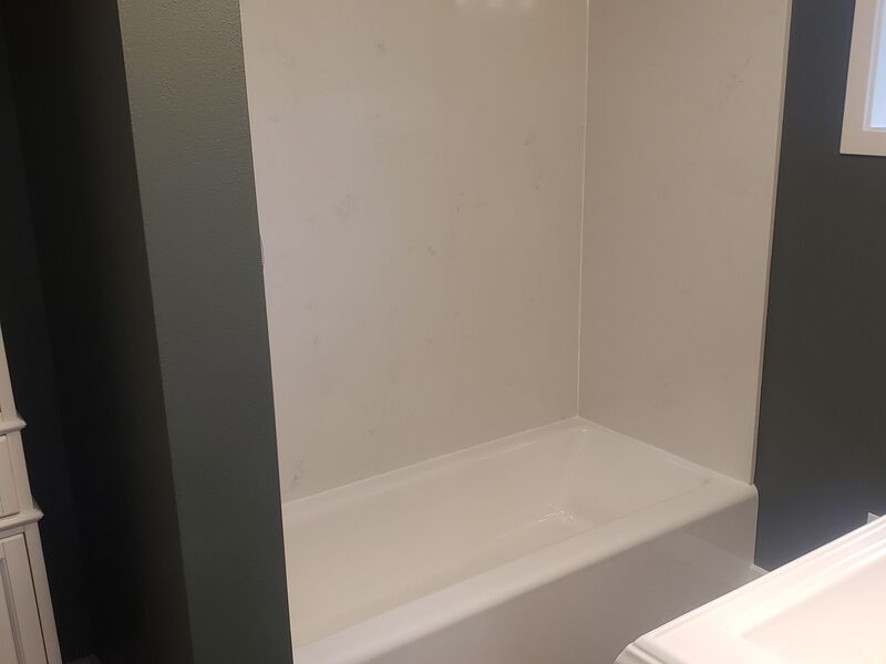 Bathroom toilet and pedestal sink remodel with tile flooring
