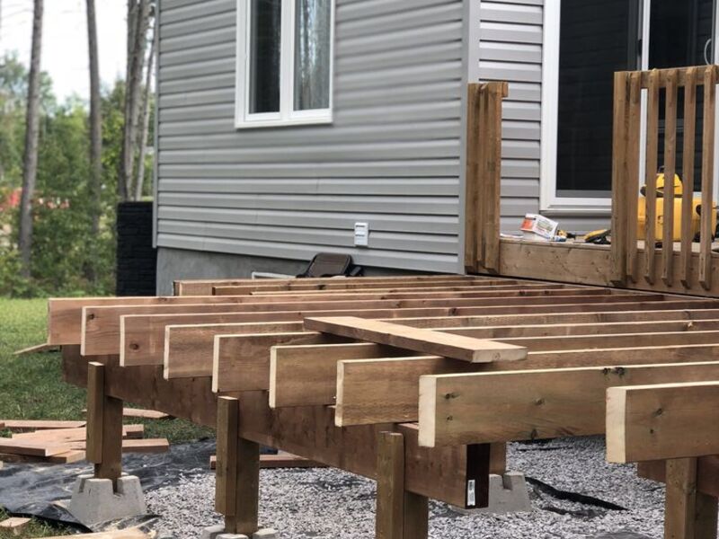 Deck foundation piers and joist framing, wide view
