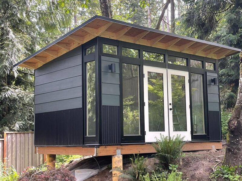 Completed elevated post foundation supporting backyard studio by ArchAngel Construction Services