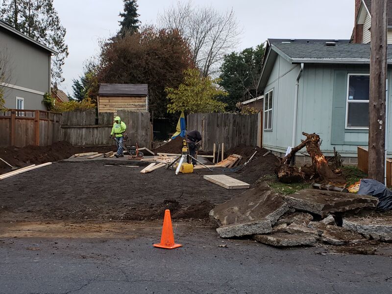 Excavation and old concrete slab removal for foundation prep
