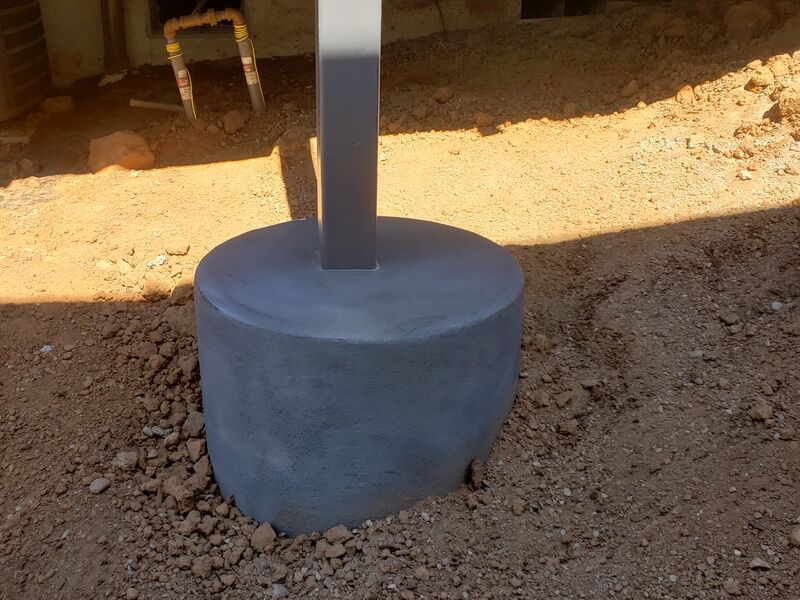 New concrete footing and support post installation