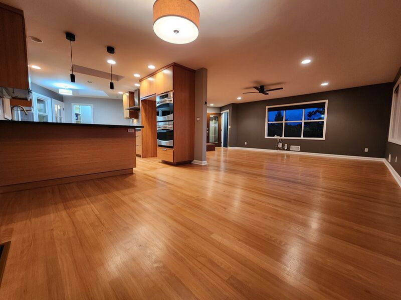 Completed kitchen and open living area, evening view
