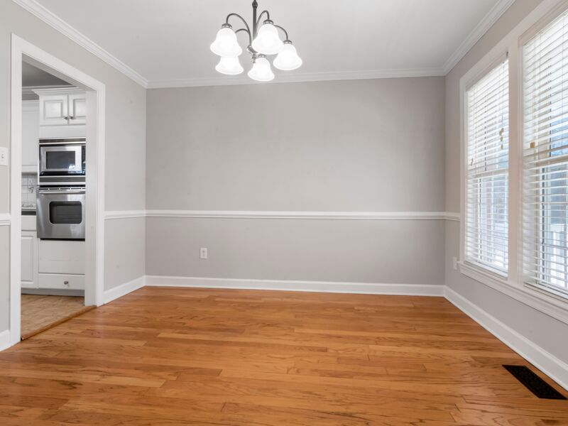 Freshly painted foyer with arched window and columns