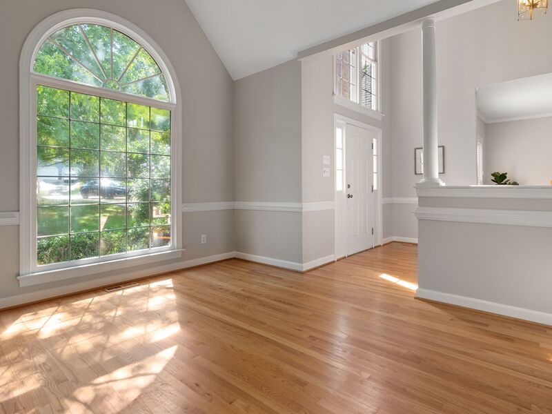 Freshly painted primary bedroom with vaulted ceiling