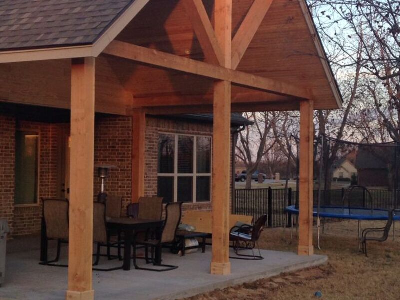 Cedar gable patio cover with dining area by ArchAngel Construction Services