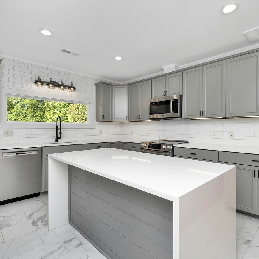 Kitchen remodel with tile backsplash and quartz countertop